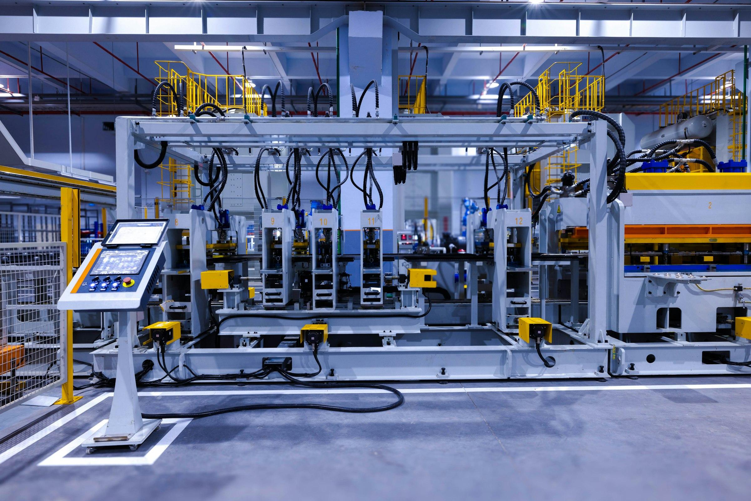 Enclosed industrial press cell with a free-standing touchscreen control panel