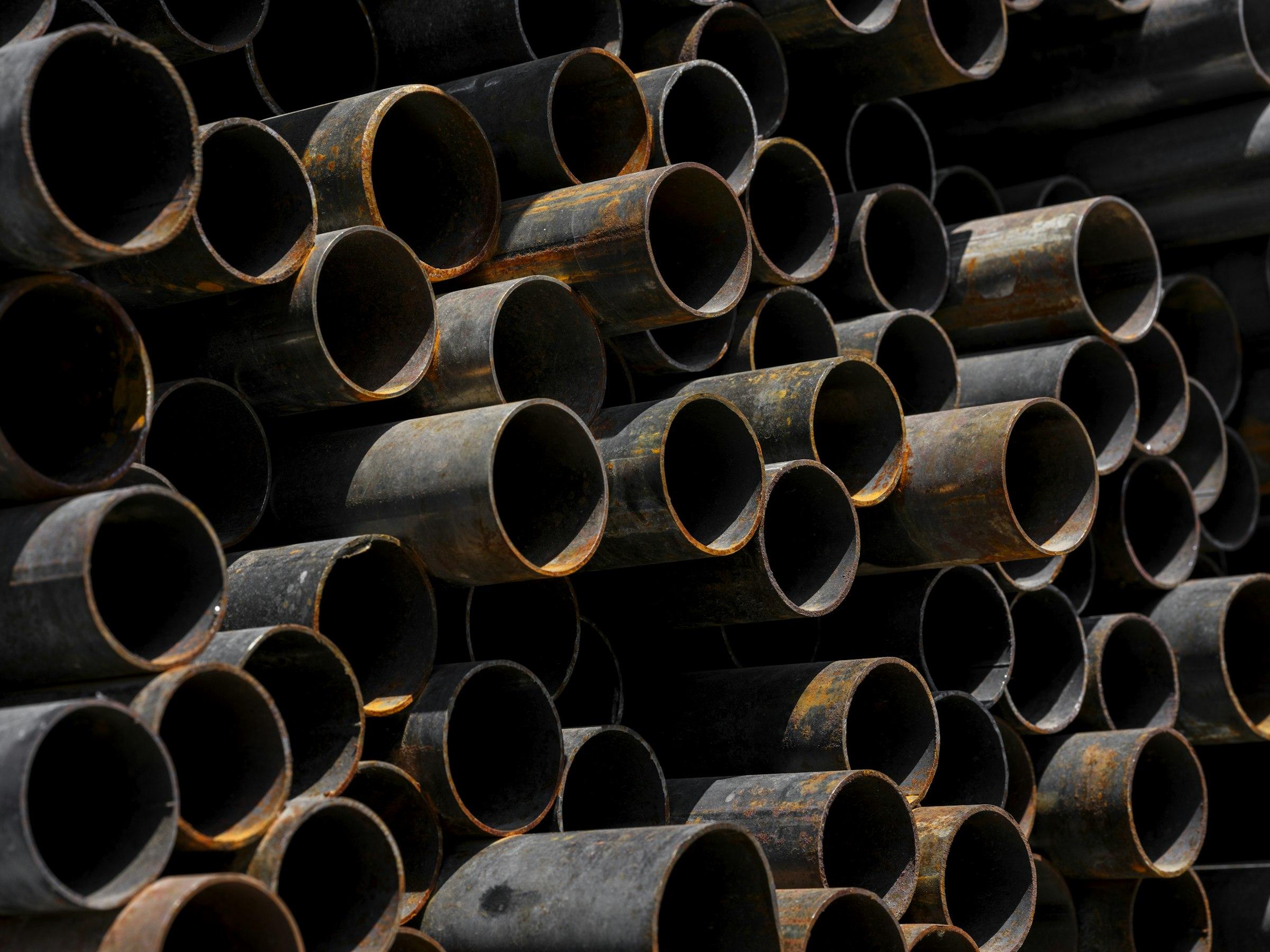 Stack of steel pipe sections seen end-on